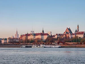 Images Dated 10th May 2023: View over River Vistula towards The Old Town and Royal Castle at sunrise, Warsaw