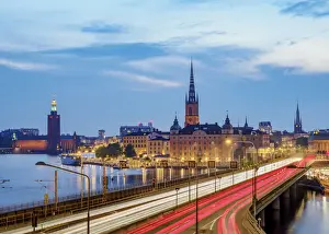 View over Sodra Jarnvagsbron Bridge towards the Riddarholmen Church and City Hall at dusk, Stockholm, Stockholm County, Sweden