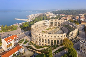 Adriatic Sea Prints: View of the St. Anthony Church and Pula Arena at sunrise. Pula, Istria, Croatia