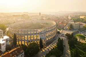 Adriatic Sea Prints: View of the St. Anthony Church and Pula Arena at sunrise. Pula, Istria, Croatia