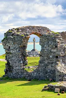 Anglesey Prints: View towards St Dwynwen Church ruins and a Celtic cross on Llanddwyn Island in Anglesey