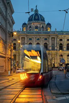 Osterreich Prints: View of a tram with Natural History Museum (Naturhistorisches Museum) in the background at dusk