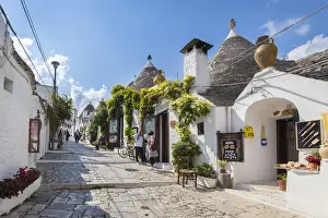 View of the typical Trulli huts and the alleys of the old village of Alberobello