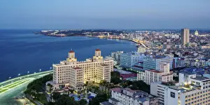 View over Vedado towards Hotel Nacional and El Malecon at dusk, Havana
