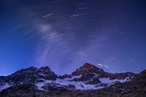 Kibo Peak Prints: Views of Mawenzi peak with star trail, Mount Kilimanajro under the moonlight, Tanzania