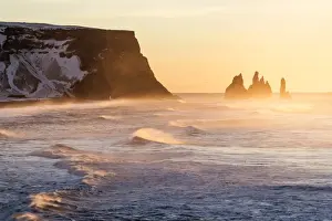 Vik, Southern Iceland, Europe. The rock formations of Reynisdrangar and ocean waves