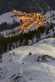 Agordino Gallery: The village of Colle Santa Lucia, seen from above on a cold winter evening, Belluno