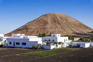 Village and Volcano in rural area of La Geria, Lanzarote, Canary Islands, Spain