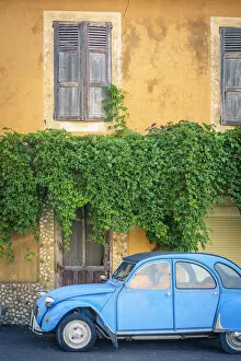 Empty Gallery: Vintage blue Citroen 2cv parked in front of a house in Castellet, Vaucluse