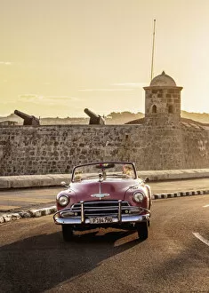 Cars Collection: Vintage Car at El Malecon with San Salvador de la Punta Castle in the background, sunrise