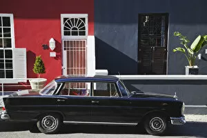 Images Dated 13th October 2010: Vintage car parked outside colourful houses, Waterkant, Cape Town, Western Cape, South