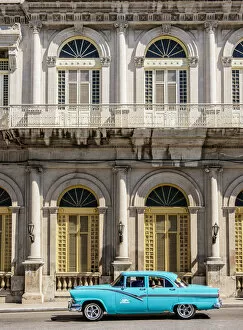 Colonial Gallery: Vintage car passing in front of Casino Espanol, Libertad Square, Matanzas