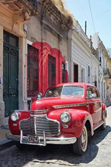 Images Dated 27th April 2023: A vintage Chevrolet Master Deluxe car in front of a colonial house in San Telmo, Buenos Aires