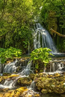 Jumping Prints: At the Volturno waterfalls the waters flow rapidly among the stones forming jumps