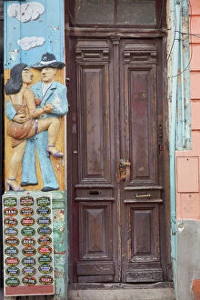 Images Dated 27th April 2023: A wall art painting of a couple dancing tango at La Boca, Buenos Aires, Argentina