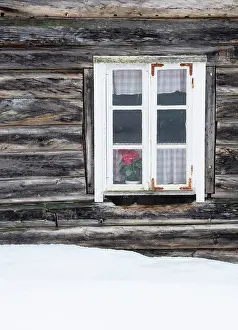 Wooden House Prints: Wall and window of old wooden house in the snow