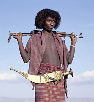 Images Dated 5th February 2009: Warriors of the nomadic Afar tribe wear their hair
