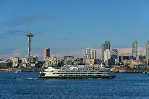 Washington State Ferry with downtown skyline and Space Needle behind, Seattle, Washington, USA