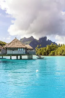 Water bungalows of Hilton resort in the lagoon of Bora Bora, French Polynesia