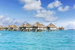 Water bungalows of Intercontinental resort in the lagoon of Bora Bora, French Polynesia