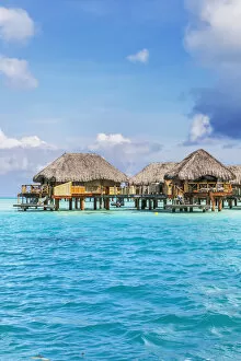 Water bungalows of Pearl beach resort in the lagoon of Bora Bora, French Polynesia