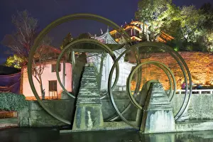 Water wheels at dusk, Lijiang (UNESCO World Heritage Site), Yunnan, China
