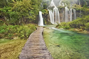 Croatia Collection: Waterfall and wooden footbridge - Croatia, Lika-Senj, Plitvice Lakes - Plitvice Lakes