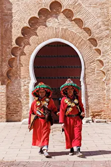Marrakech Prints: Watersellers in front of iconic door, Marrakech, Morocco