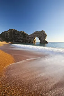 Waves break onto Durdle Door beach, Jurassic Coast, Dorset, England. Winter Waves break onto Durdle Door beach, Jurassic Coast, Dorset, England. Winter
