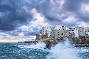 Bari Province Prints: Waves crash on the cliff during a winter storm. Polignano a Mare, Apulia, Italy