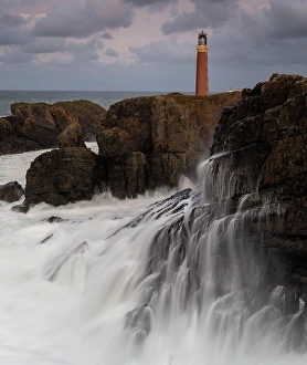 Premium Selects 2024 Prints: Waves crashing on cliffs below lighthouse at the Butt of Lewis