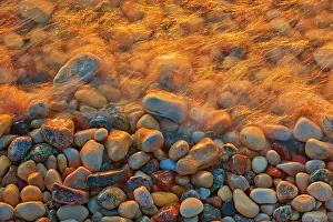 Prairie Province Prints: Waves crashing on rocky shoreline of Lake Winnipeg at sunrise. Matlock, Manitoba, Canada