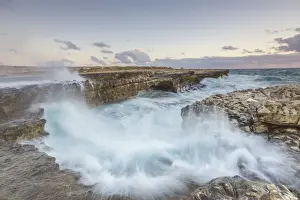 Crashing Prints: Waves of the rough sea crashing on the cliffs of Devils Bridge Caribbean Antigua