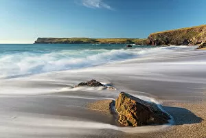 Images Dated 5th July 2022: Waves surge onto Greenaway Beach near Polzeath, Cornwall, England. Spring (June) 2022