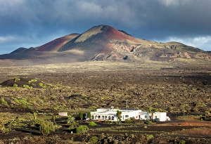 Volcanic Landscape Prints: White house in the volcanic landscape near La Geria, Lanzarote, Canary Islands, Spain