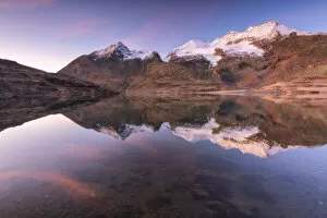 White lake at dawn in Bernina pass Graubunden, Switzerland