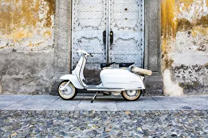 Doorway Prints: White Lambretta Innocenti scooter in the old town, Morbegno, province of Sondrio