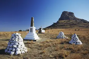 White stone cairns and memorials to British soldiers at Isandlwana, Thukela, KwaZulu-Natal