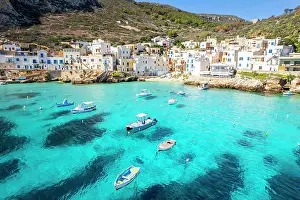 Tyrrhenian Prints: white village of Levanzo with boats in the turquoise lagoon