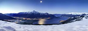 Night Photography Prints: Wide angle shot of Alto Lario with Como lake and mount Legnone lighted by the moon in winter