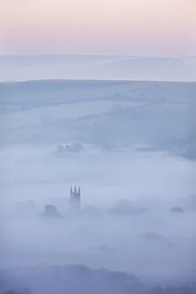 Widecombe-in-the-Moor Church surrounded by mist at dawn, Dartmoor National Park, Devon