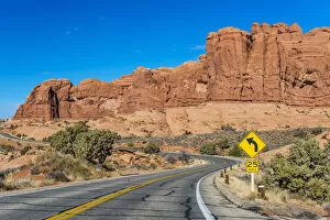 Deserted Collection: Winding road in a desert landscape, Arches National Park, Utah, USA
