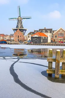 Haarlem Prints: Windmill De Adriaan reflected in the canal of the Spaarne river, Haarlem, North Holland