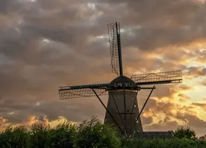 Windmill in Kinderdijk at sunset, UNESCO World Heritage Site, South Holland