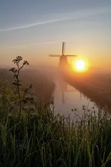 North Holland Prints: A windmill at sunrise, North Holland, Netherlands