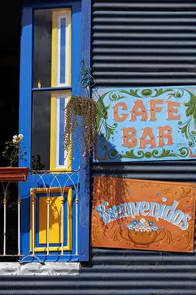 The window of a colorful bar in the 'Caminito de La Boca'with wall decorations in 'Fileteado Art'