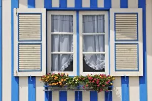 Images Dated 26th July 2014: Window of a traditional striped painted house in the little seaside village of Costa Nova