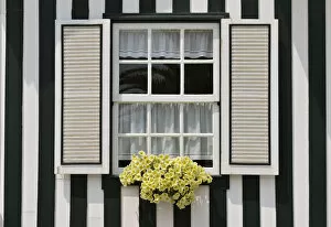 Images Dated 12th September 2014: Window of a traditional striped painted house in the little seaside village of Costa Nova