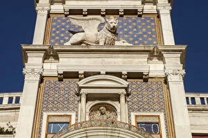 The winged lion of Saint Mark at The Clock Tower in the Piazza San Marco, Venice, Veneto
