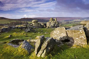 Winter morning sunshine glows on Hound Tor, Dartmoor National Park, Devon, England Winter morning sunshine glows on Hound Tor, Dartmoor National Park, Devon, England
